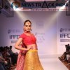 A model showcasing Akanksha and Dhruv Arora at India Runway Week 2013