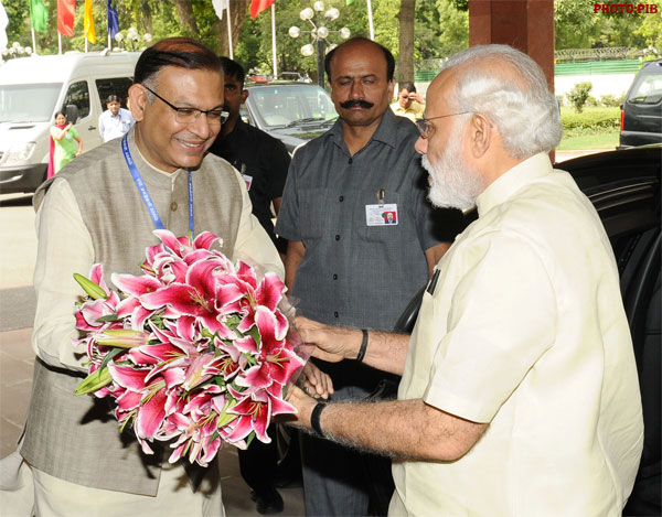 PM Modi being welcomed by the Minister of State for Finance